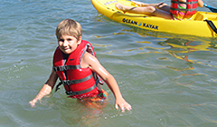 Photograph of a Child enjoying a summer float.