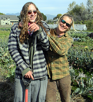 Photograph of two youths working at the Youth Farm.