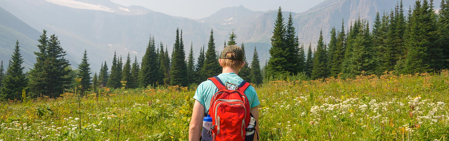 Young adult hiking in Glacier National Park