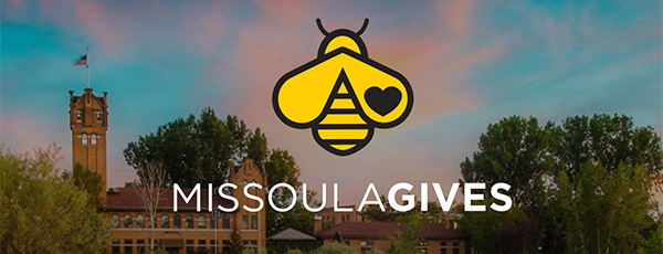 Beautiful missoula sky with Missoula Gives and bee logo