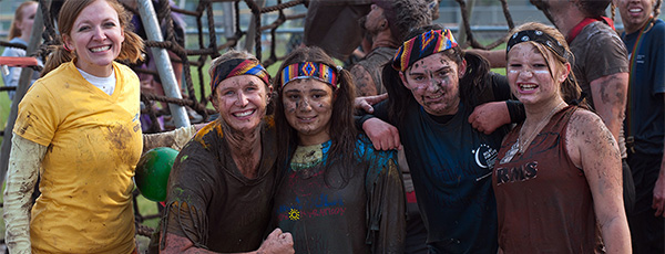 Runners after the mud run. Lots of muddy faces.